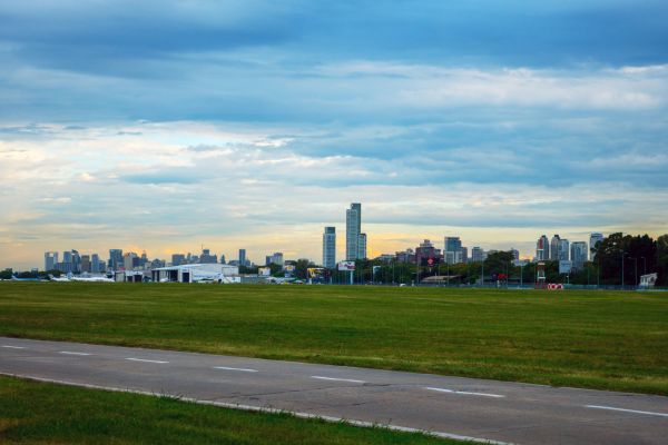 Image of airfield at Aeroparque jorge newbery airport with the city skyline of Buenos Aires in the distance