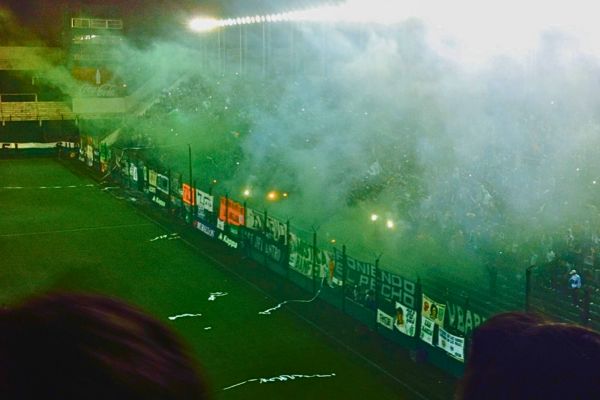 Full stadium at CA Banfield in Buenos Aires filled with smoke from flares.