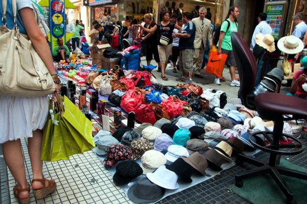 Shopping Street in Buenos Aires with goods being displayed on the street.