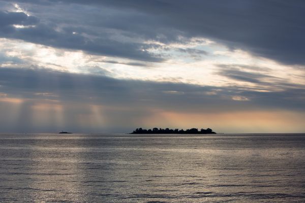 Island in distance in Rio de la Plata, between Buenos Aires and Uruguay.