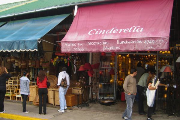 People browsing stalls at Puerto de Frutos market in Buenos Aires.