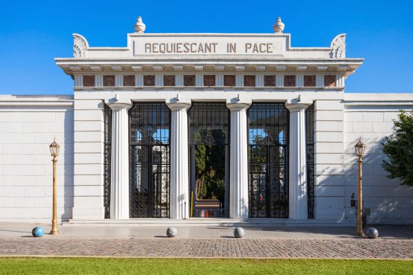 Facade of the entrance to Recoleta Cemetery in Buenos Aires with the words 'Requiescant in Pace'.