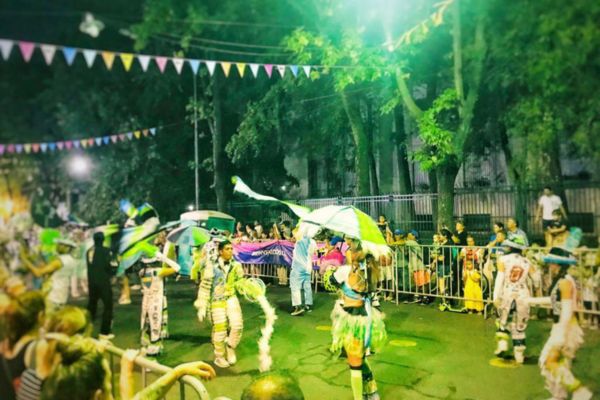 A lively murga performance at Plaza Irlanda in the Caballito neighborhood of Buenos Aires, Argentina.