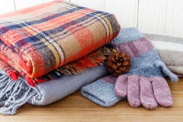 Image of warm scarfs and gloves.