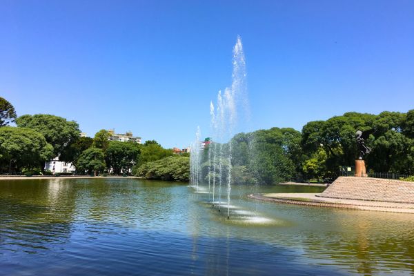 Fountain jets spouting water upwards in the lake at Parque Centenario, Buenos Aires.